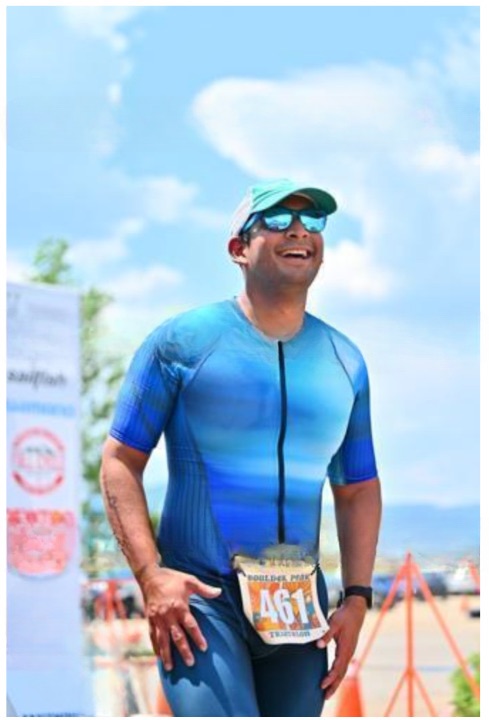Narayana grinning at the finish of the Boulder Peak triathlon